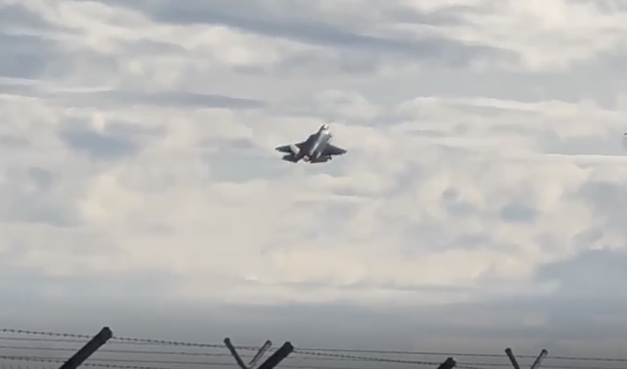 F-35 jet taking off in the distance. 